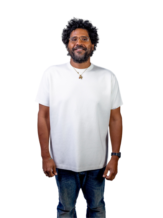 Front view of a man wearing a white TG1 T-shirt