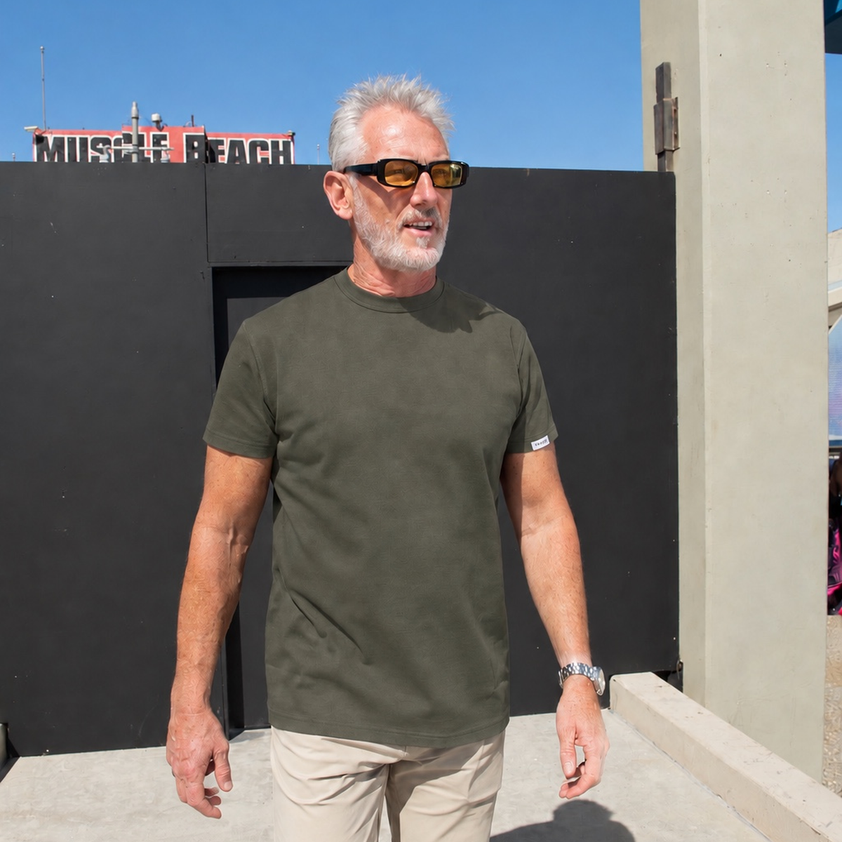 Man wearing the TGTHR TG1 heavyweight 420 GSM cotton t-shirt in Olive
