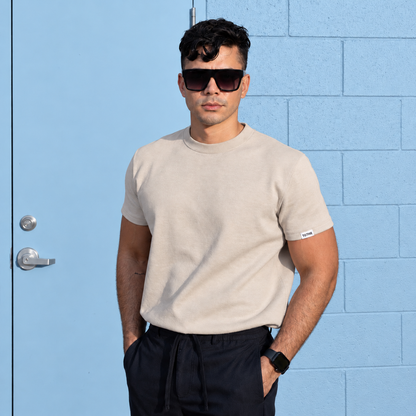 Man wearing the TGTHR TG1 heavyweight 420 GSM cotton t-shirt in Stone